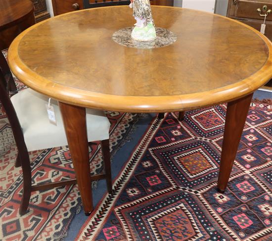 A circular burr walnut marble inset dining table, Diameter 120cm